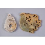 TWO CHINESE CARVED JADE PENDANTS, one of a bi - disk 7cm, the other of a dragon, 8cm