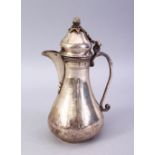 A GOOD 17TH / 18TH CENTURY TURKISH SILVER COFFEE POT, with a gilt acorn finial, moulded handle and