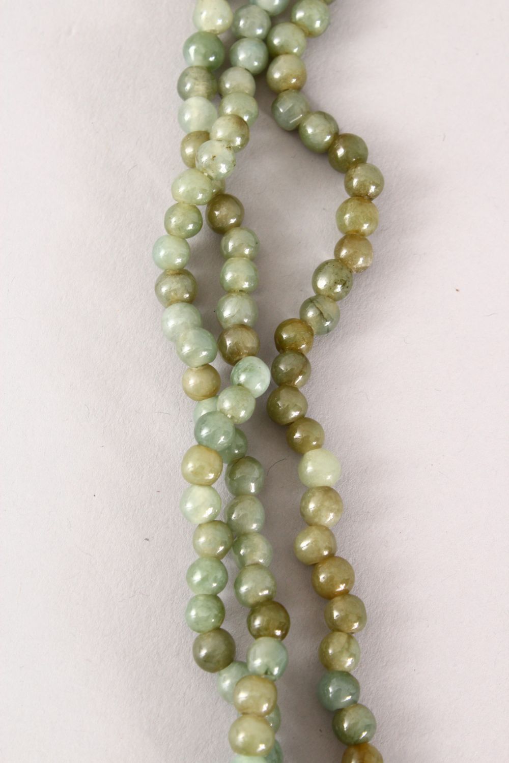 A GOOD CHINESE CARVED JADE / HARD STONE BEAD NECKLACE, with seven runs of beads, Approx 55cm. - Image 3 of 4