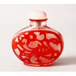 A19TH / 20TH CENTURY CHINESE RED OVERLAY GLASS SNUFF BOTTLE, depicting kylin and flora, with hard