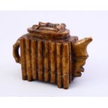 A CHINESE BAMBOO CARVED SOAP / HARD STONE TEA POT AND COVER, 10CM X 16CM.