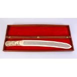 A FINE 19TH CENTURY BURMESE CARVED AND PIERCED IVORY PAGE TURNER, the handle incorporating a