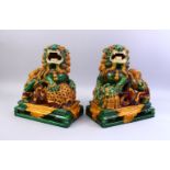A GOOD PAIR OF 20TH CENTURY CHINESE SANCAI GLAZED POTTERY FOO / LION DOG FIGURES, a mirrored pair,