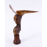 A CARVED HORN FIGURE OF A BIRD, 20cm high.