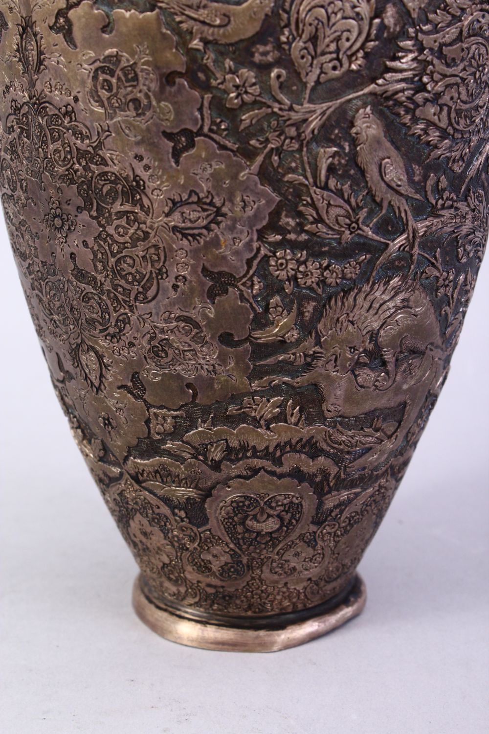 A 18TH / 19TH CENTURY IRANIAN CARVED SILVER VASE, with a multitude of decoration depicting flora and - Image 10 of 12
