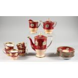 A NORITAKE COFFEE SERVICE, red and pink ground with gilded floral decoration and border,