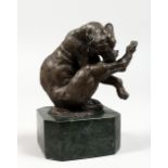 A SMALL BRONZE OF A LION. Signed, on a marble base. 5.5ins high.