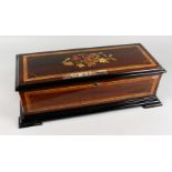 A VERY GOOD 19TH CENTURY SWISS MUSICAL BOX, in a rosewood case inlaid with flowers, fully