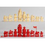 AN EARLY 20TH CENTURY CARVED AND STAINED IVORY MINIATURE CHINESE CHESS SET. 1.75ins high and