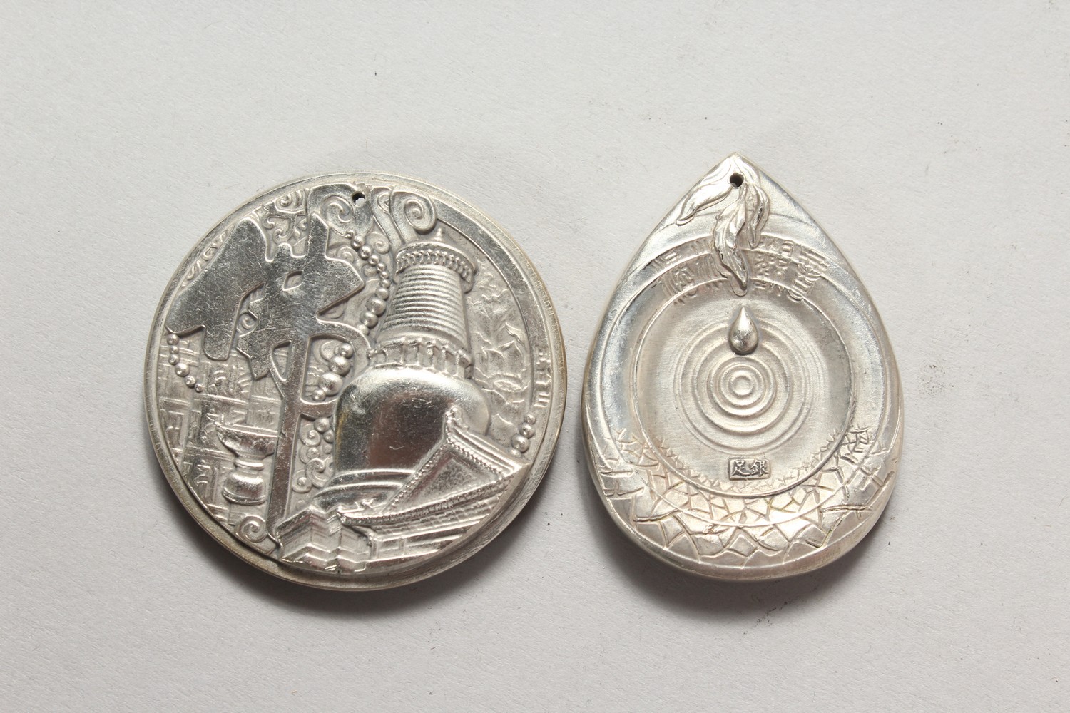 TWO CHINESE WHITE METAL PENDANTS. 2ins high. - Image 2 of 2