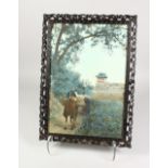 A CHINESE CARVED AND PIERCED FRAME, containing a photographic print. Frame: 17ins x 12ins.