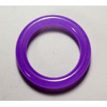A CHINESE "LAVENDER JADE" BANGLE. 3.5ins diameter.