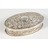 A VICTORIAN OVAL SILVER PIN BOX AND COVER, with repousse decoration. London 1890.