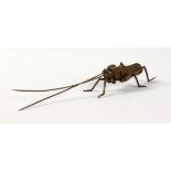 A SMALL JAPANESE BRONZE ARTICULATED LOCUST. 5.75ins long.