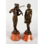 A PAIR OF BRONZE ART NOUVEAU LADIES on onyx bases. 8ins high.