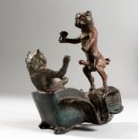 AN EROTIC BRONZE OF A CAT AND DOG IN A CAR in the Vienna style. 4ins high.