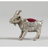 A SMALL NOVELTY SILVER GOAT PIN CUSHION. 1.25ins long.