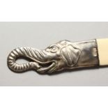 A SILVER ELEPHANT HEAD MOUNTED PAGE TURNER. 10.75ins long.