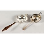 TWO SILVER TEA STRAINERS.