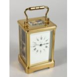 A GOOD ASPREY OF LONDON BRASS FRENCH CARRIAGE CLOCK, made in England, with eleven jewels, white