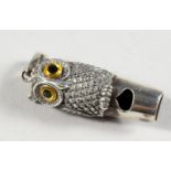 A NOVELTY SILVER OWL WHISTLE. 1.75ins long.