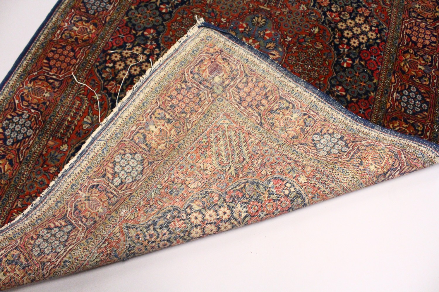 A KASHAN RUG, 20th Century dark blue ground with allover stylized tree and flower decoration. 6ft - Image 7 of 8