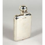 A GOOD, SMALL SILVER HIP FLASK, with unusual captive top. London 1908. 4.75ins high.