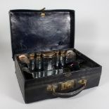 VOYAGE, 23 RUE DE LA PEPINIERE, PARIS A LEATHER DRESSING CASE, with silver top botle.