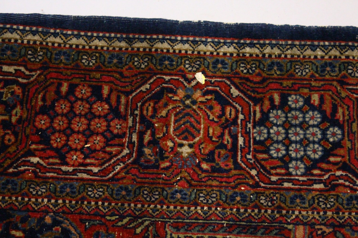 A KASHAN RUG, 20th Century dark blue ground with allover stylized tree and flower decoration. 6ft - Image 4 of 8