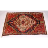 A GOOD SMALL PERSIAN RUG, MID 20TH CENTURY, beige ground with stylised Boteh, birds and flowers. 6ft