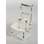 A SILVER-PLATED CHAIR THREE PIECE CRUET SET.