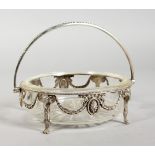 A VICTORIAN CUT GLASS SILVER FRAMED BUTTER DISH, 5ins diameter, with bead edge, garlands and rams