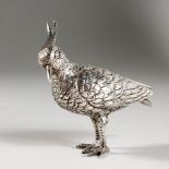 A CONTINENTAL CAST SILVER MODEL OF A GAME BIRD. 3ins long.
