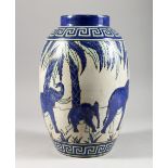 AN ART DECO DESIGN VASE, decorated with blue elephants. 12ins high.