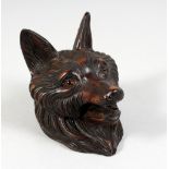 A SMALL BLACK FOREST CARVED WOOD FOXES HEAD INKWELL.