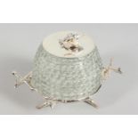A SILVER-PLATED AND CUT GLASS BEEHIVE HONEY POT ON STAND.