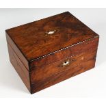 A VICTORIAN WALNUT WRITING BOX, with hinged lid and writing slope. 11.75ins wide.
