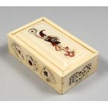 AN ETCHED BONE NOVELTY DICE BOX and DICE. 3.25ins long.