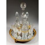 A SUPERB PIERRE-PHILIPPE THOMIRE MERCURY GILDED CIRCULAR DRINKS SET, complete with three decanters