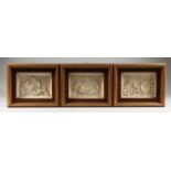 A SET OF THREE FRAMED AND GLAZED CLASSICAL PANELS, putti at play. 4ins x 6ins.