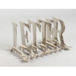 A LARGE SILVER-PLATED LETTER RACK. 8ins long.