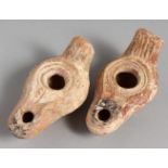 TWO SMALL TERRACOTTA OIL LAMPS.