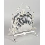 A SILVER-PLATED SHELL SHAPED MUFFIN DISH AND STAND.