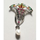 A SILVER AND PLIQUE-A-JOUR STYLE BROOCH. 2ins high.