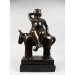 AN ART DECO BRONZE GROUP OF A FAT LADY RIDING A COW, on a marble base. 14ins high.