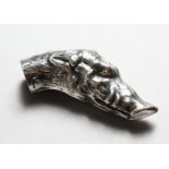 A SILVER-PLATED BOARS HEAD CANE HANDLE. 3ins long.