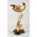 A GILT BRONZE TABLE CENTREPIECE, modelled as a lady holding a shell above her head. 16ins high.