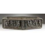 A SMALL LEAD PLANTER, of flattened hexagonal form, the sides depicting cherubs. 19.5ins long x 16ins