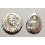 TWO CHINESE WHITE METAL PENDANTS. 2ins high.