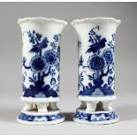 A SMALL PAIR OF MEISSEN PORCELAIN BLUE AND WHITE VASES, decorated with flowers and birds. Cross